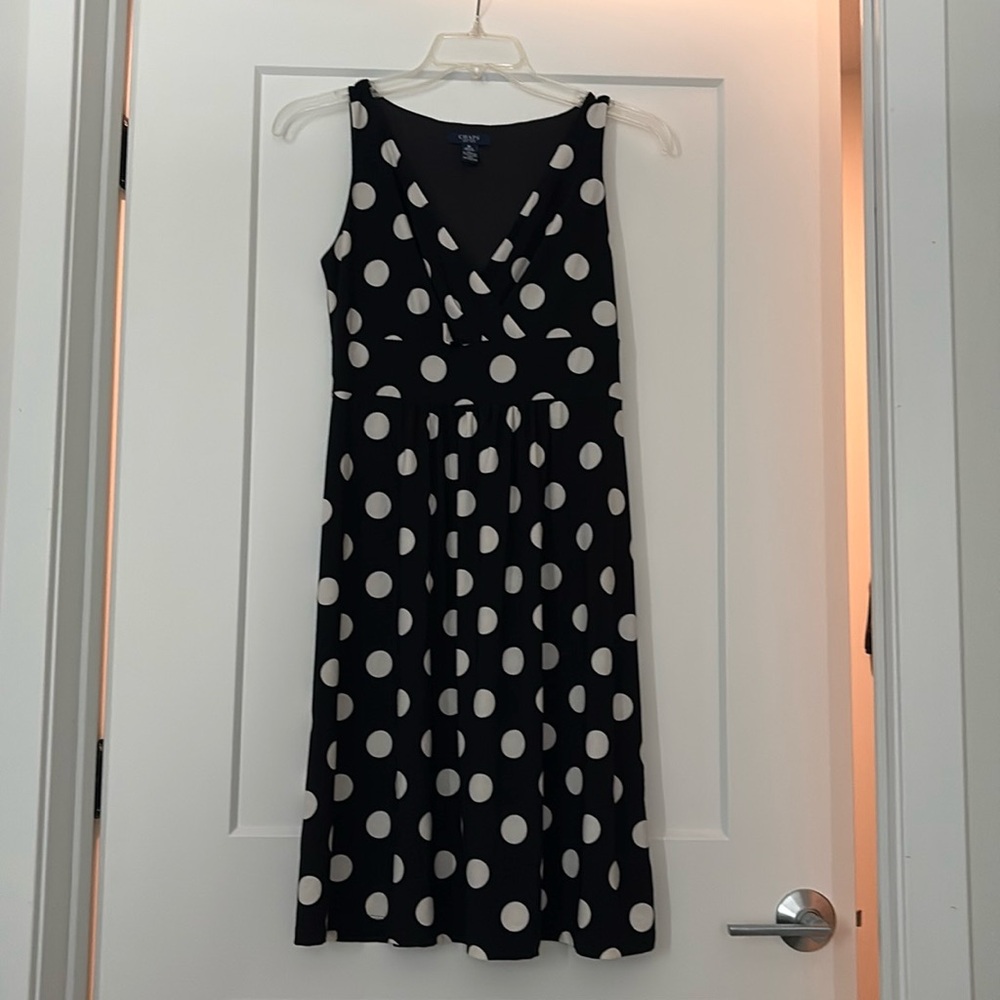 Black and white women’s polka dot dress.